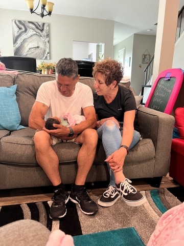 a group of people sitting around a living room