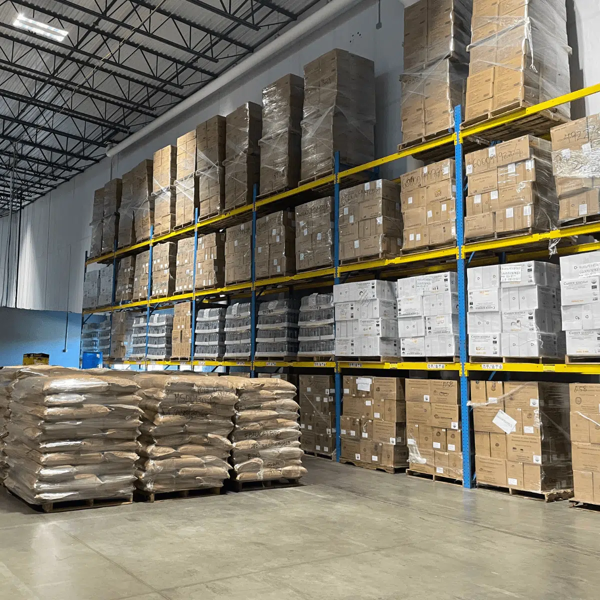 A warehouse filled with stacked boxes and shelves, ready for storage and organization.