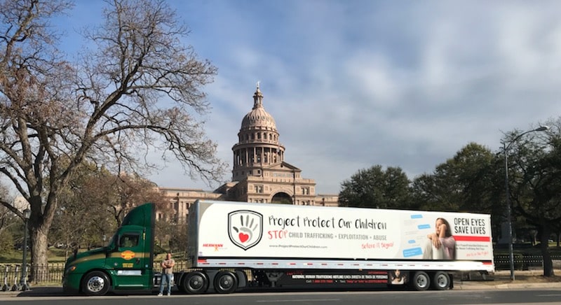 a truck is parked in front of a building