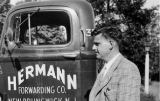 a man standing in front of a car