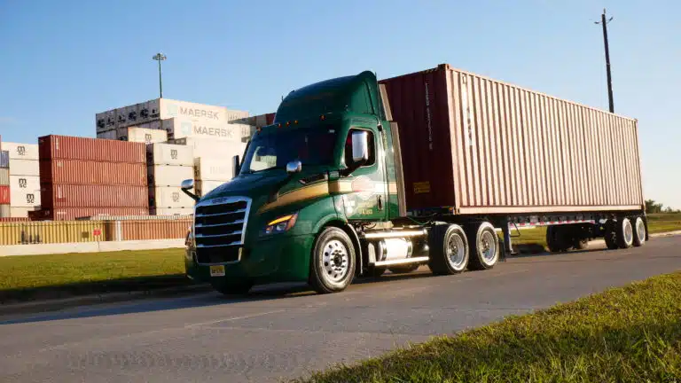 a truck that is driving down the street