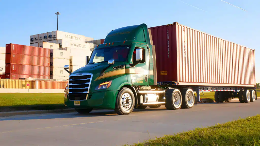 a truck driving down a street