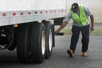 a man riding on the back of a truck