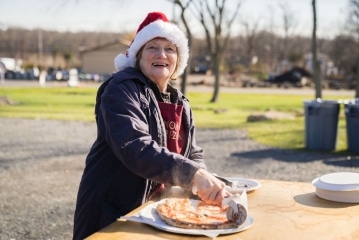 a person sitting at a picnic table