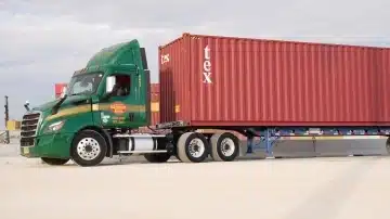 a large truck driving down a street