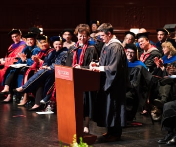 a group of people standing in front of a crowd