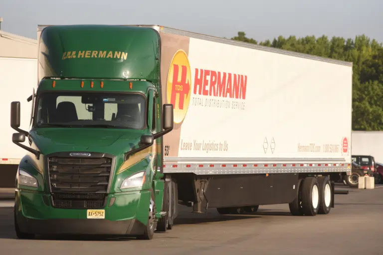 a box truck that is driving down the road