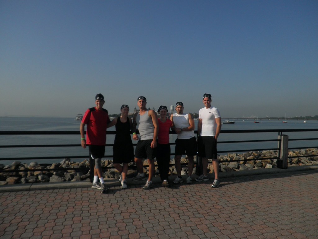 a group of people standing on a beach