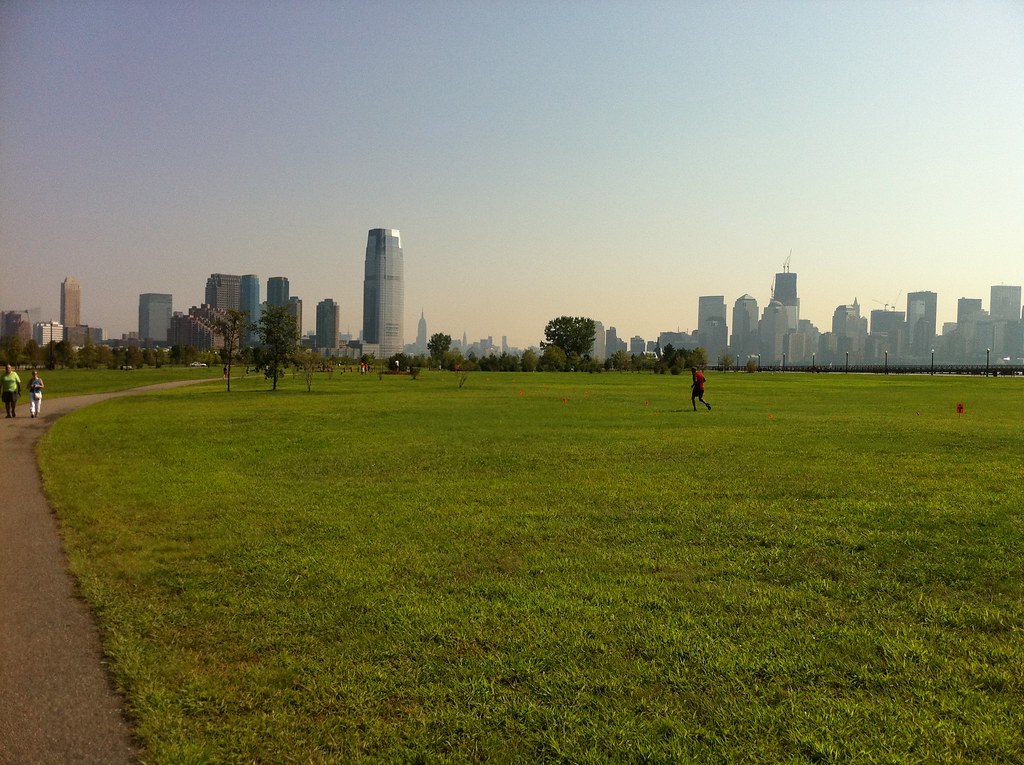 a large building with a grassy field