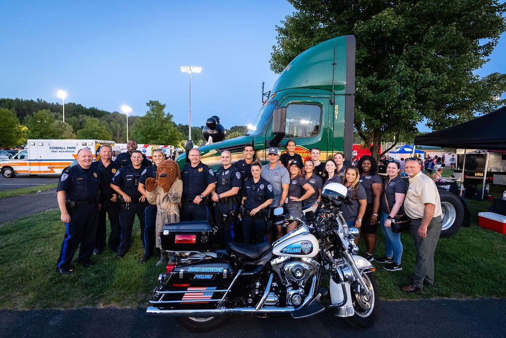 a group of people riding on the back of a motorcycle