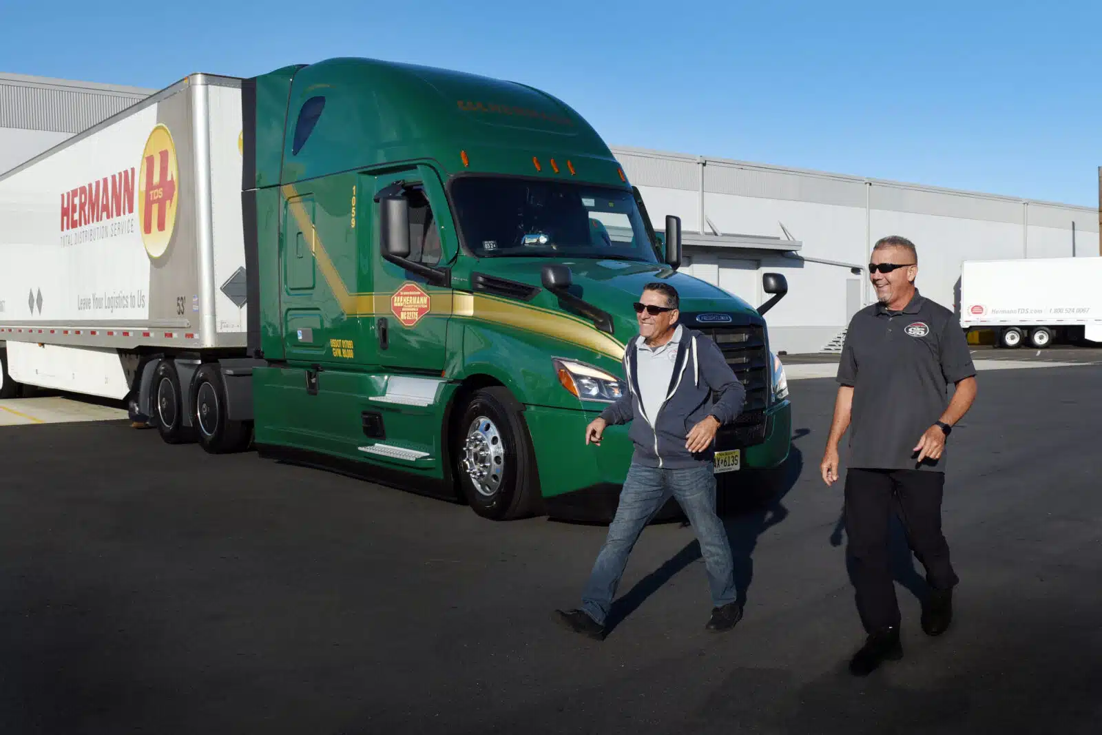 a man standing in front of a truck