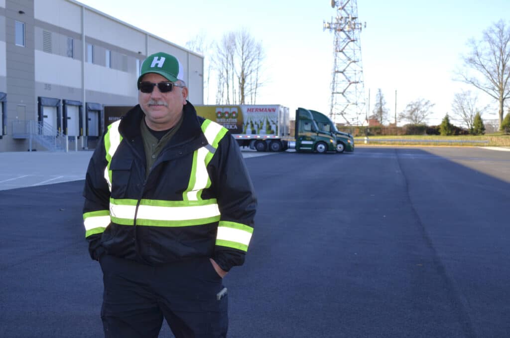 a man standing in a parking lot