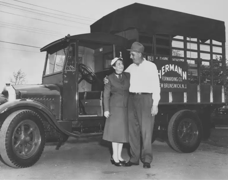 a man standing in front of a truck