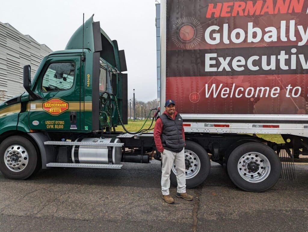 a person standing in front of a truck