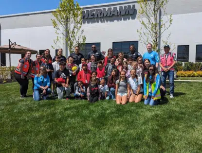 Group shot on the lawn outside a building